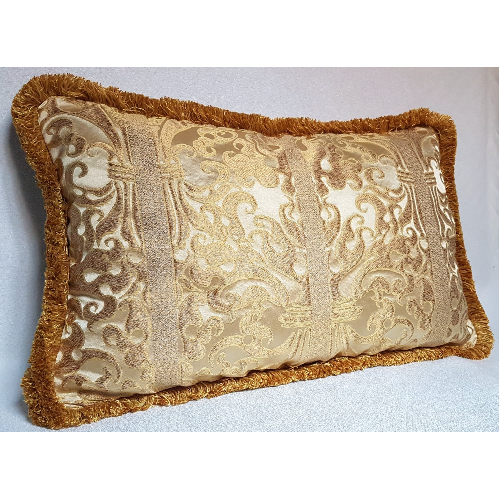 https://www.oggettiveneziani.com/5629-superlarge_default/lumbar-throw-pillow-with-brush-fringe-ivory-and-gold-silk-lampas-rubelli-fabric-belisario-pattern.jpg